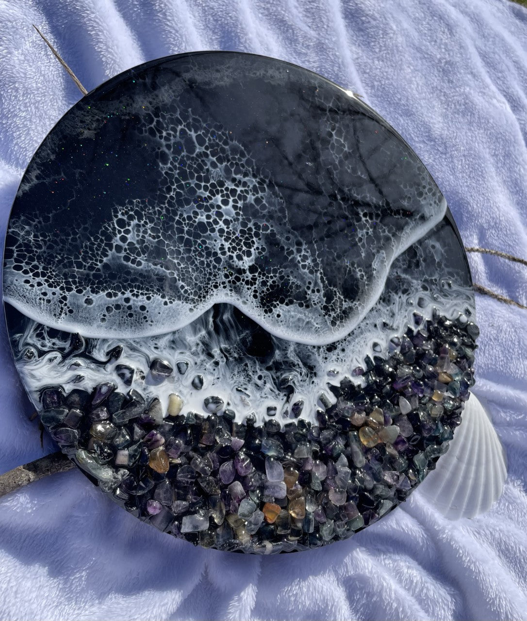 Black resin ocean with waves and rocky shore