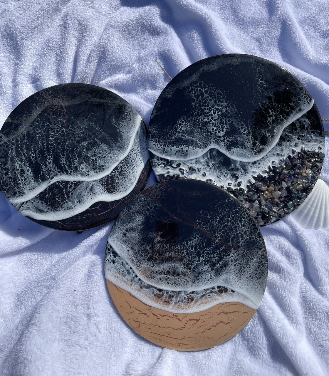Black resin ocean with waves and rocky shore